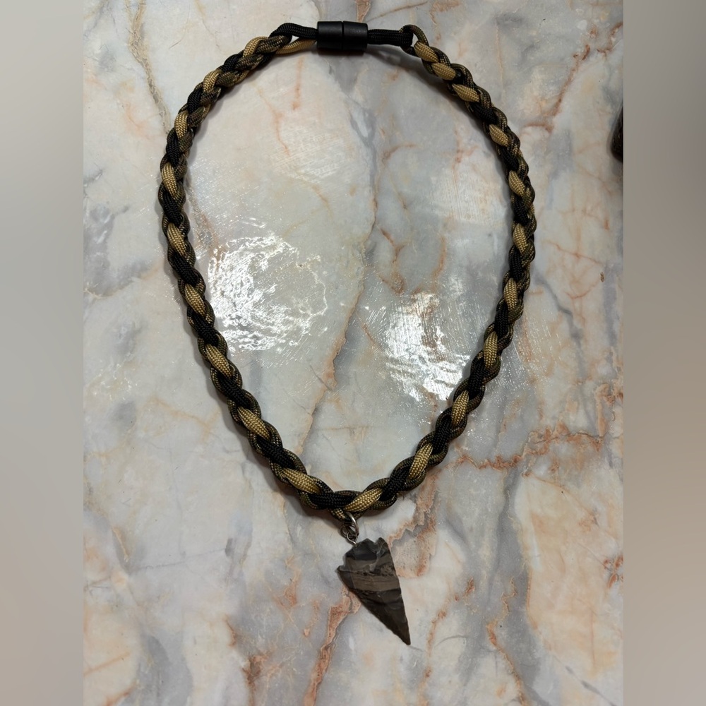 Beautiful handmade braided cord necklace with an arrowhead pendant.